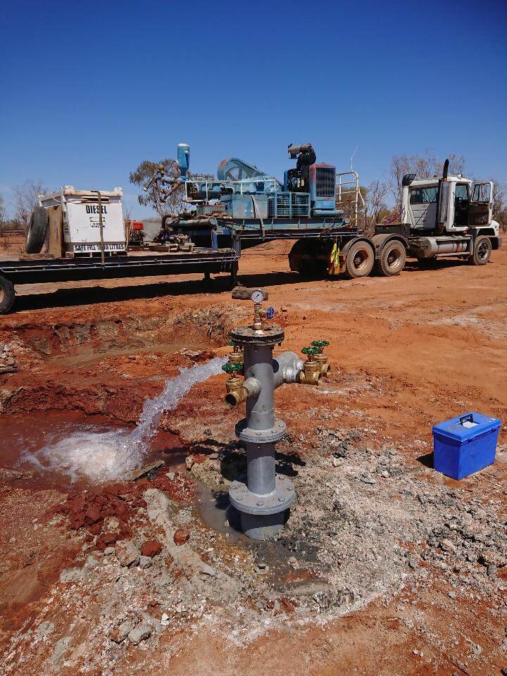 DSC_0603_1 water bore pump pouring out water onto dirt