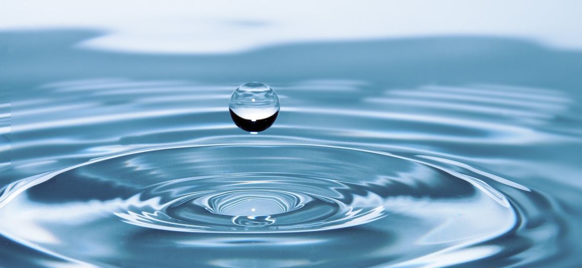drop of water floating above water