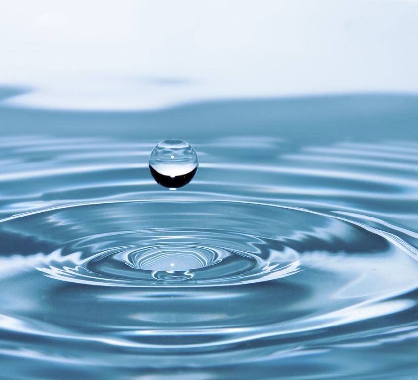drop of water floating above water